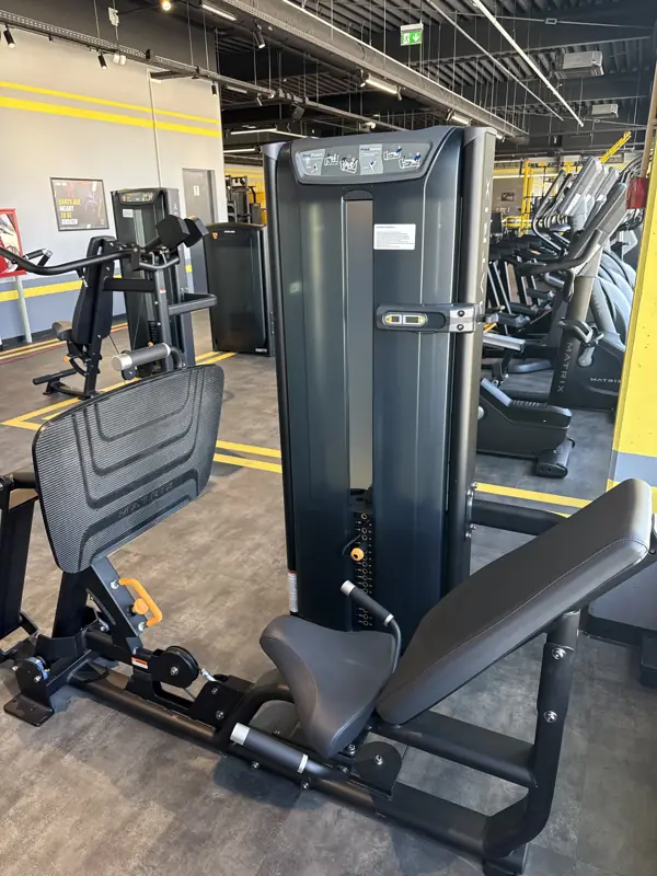 A seated leg press machine at Stay Fit