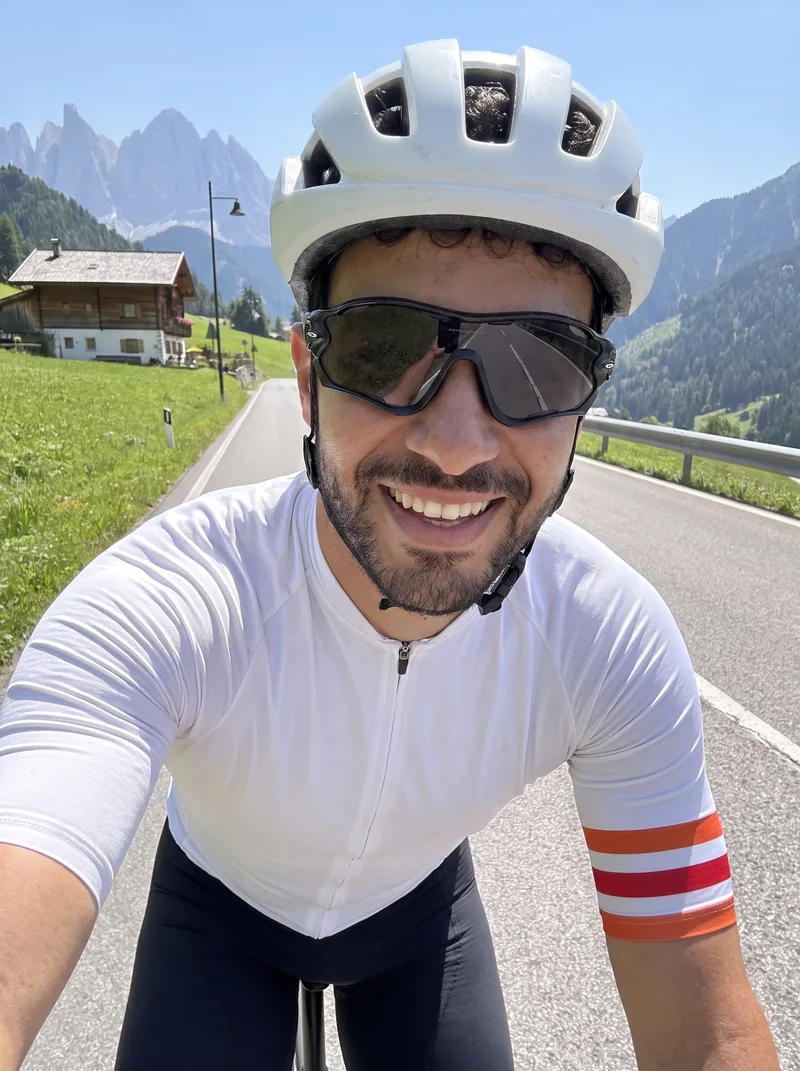 A rider on a road bike climbing a pass in the Dolomites